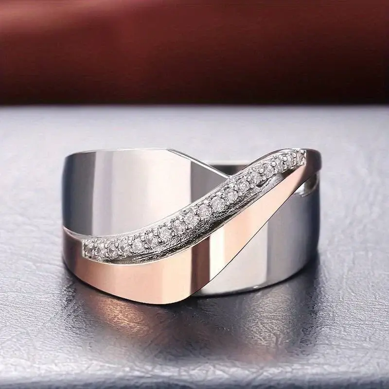 Anillo bicolor de acero con circonitas