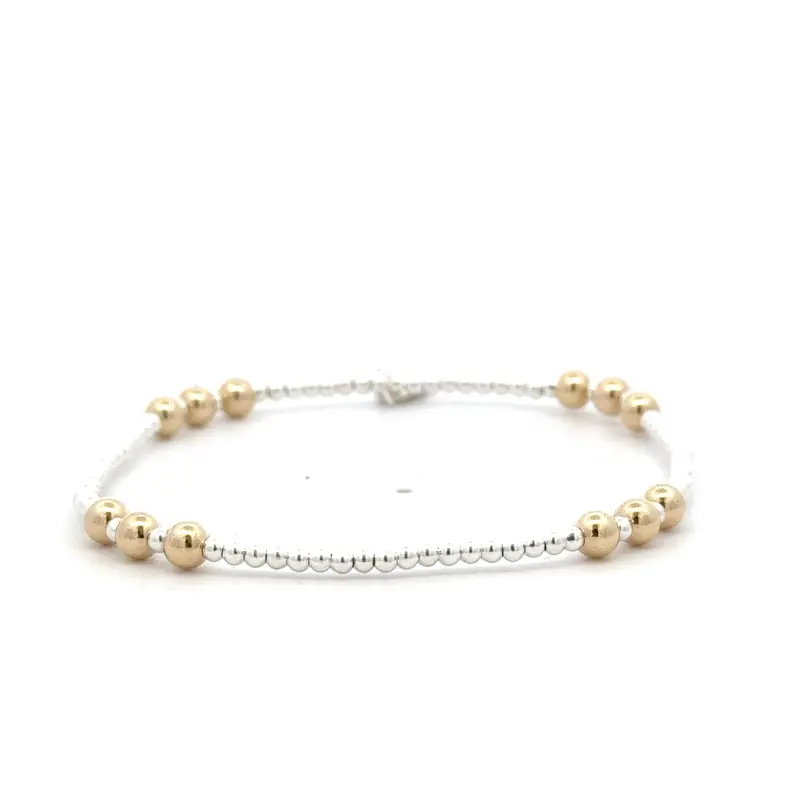 Four 3 silver - gold coloured