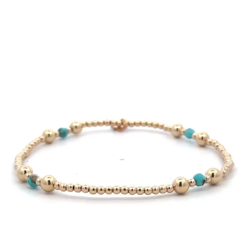 Four split turquoise gold coloured